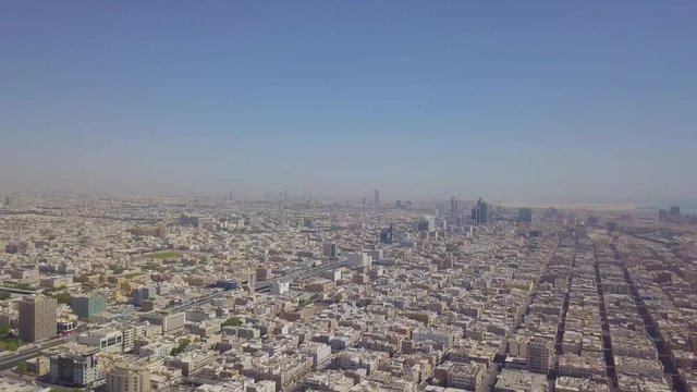 Vertical decent with view of Khobar skyline with suweiket and Khobar shamaliya and Khobar Dammam highway (4K)