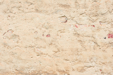 Texture of a concrete wall with cracks and scratches which can be used as a background