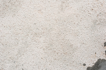 Texture of a concrete wall with cracks and scratches which can be used as a background