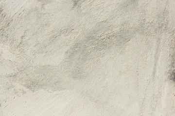 Texture of a concrete wall with cracks and scratches which can be used as a background