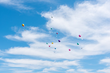 Fototapeta na wymiar balloons with greeting cards in the sky