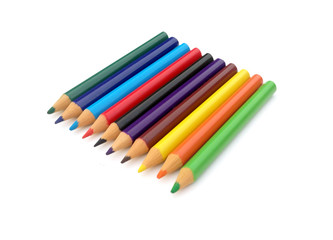 many different colored pencils on a white background.