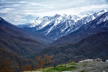 Fototapeta na wymiar Mountain landscape, mountain tops in the snow. Dalina between the mountains. ski mountaineering