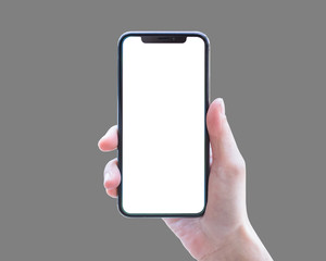 Smartphone in woman's hand isolated on grey background with blank white screen (clipping path)  for...