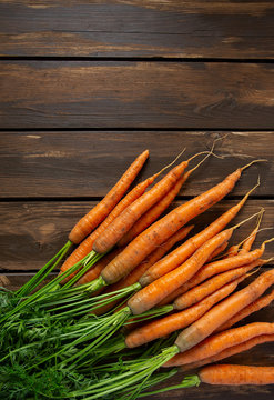 Fresh Carrots On Wooden Surface