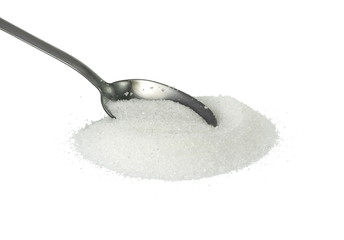 Heap of granulated sugar in a spoon isolated on white background. - obrazy, fototapety, plakaty