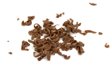 Grated chocolate. Heap of ground chocolate isolated on white background with clipping path, closeup.