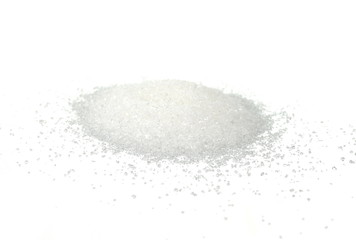 Heap of granulated sugar isolated on white background.