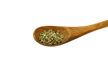 Pile of dried oregano in a wooden spoon  isolated. Pile of dried oregano leaves on a white background. Spice for pizza. Pizza ingredients.