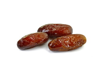 Dried dates over white background. Heap of dried dates isolated on white background.