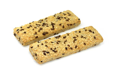 Breadsticks or grissini with sesame and linseed isolated on white background. Salt cracker isolated.
