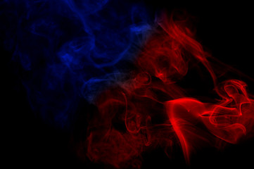 color smoke as abstract shape in the air on black background