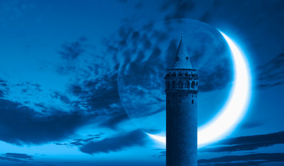 Night sky with moon in the clouds - Galata Tower with crescent moon - istanbul, Turkey 