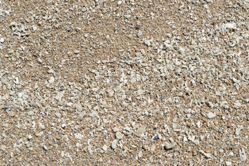 Sand on the coast of the sea close up. Natural abstract background