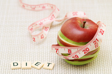 An apple and flexible ruler as a concept of dieting and weight control
