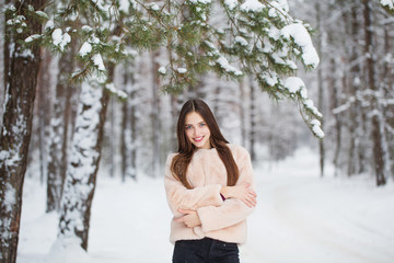 beautiful girl in winter forest