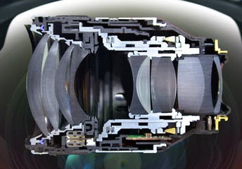 Cut haft cross section camera lens isolated on lens front background.