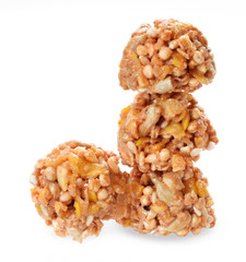 Cereal crunchy snacks with seeds and nuts in stack isolated on white