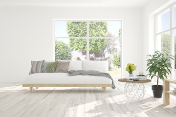 Stylish room in white color with sofa and summer landscape in window. Scandinavian interior design. 3D illustration