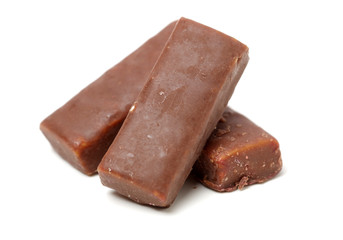 Chocolate peanut candy on white background