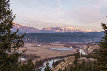 early spring morning at columbia river valleynear Radium Hot Springs with rocky mountains on the background.