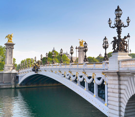 famous and beautiful Alexander III bridge in Paris crossing the Seine river