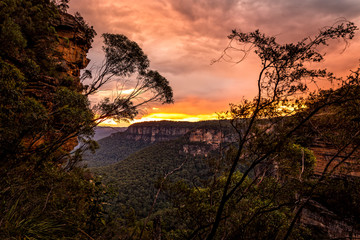 Sunset over the cliffs and valleys of Blue Mountains