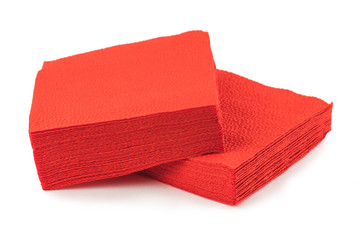 stack of clean red paper napkins on a white background.