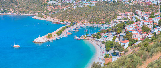 Fototapeta premium Holidaymakers sunbathing at Kalkan beach - Kalkan, Turkey