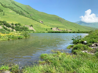 Russia, North Ossetia. Midagrabin (Midagrabinskoe) lake in the mountains in summer morning