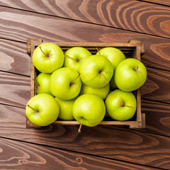 Fresh apples on wooden background. Top view