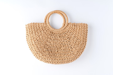 Women's straw bag isolated on white background