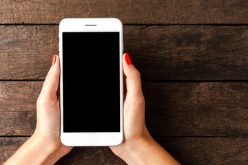 Woman using smartphone. Top view