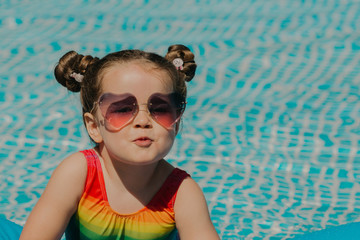 Portrait of babygirl in swimming pool.