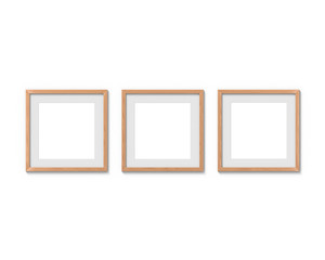 Set of 3 square wooden frames mockup with a border hanging on the wall. Empty base for picture or text. 3D rendering.