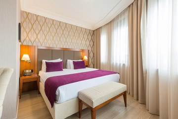 Fototapeta na wymiar Luxury double bed hotel bedroom interior