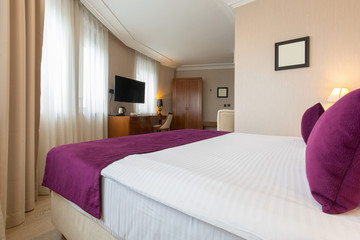 Luxury double bed hotel bedroom interior
