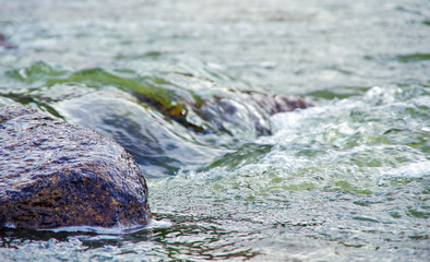 Fast flowing water in the mountain river