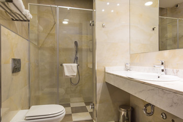 Hotel bathroom interior with shower cabin