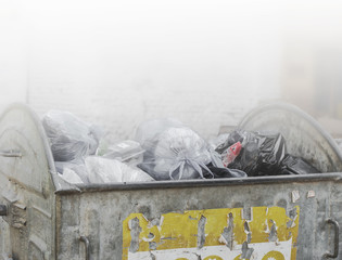Dumpsters being full with garbage