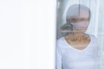 Woman standing while gazing