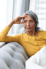 Woman inside a room thinking