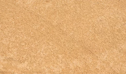 Sandbeschaffenheit. Gelb-brauner abstrakter Hintergrund. Sommer. Sonniger Tag. © Viktor