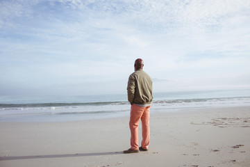 African-American man standing on the beach
