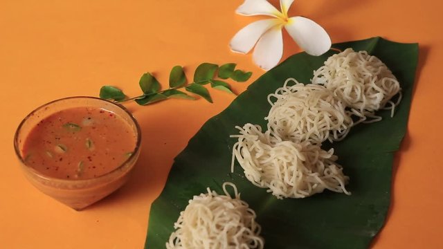 Breakfast dish with rice noodles known as Idiyappam or Idiyappam served with egg roast.