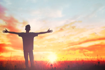 Happy man rise hand on morning view. Christian inspire praise God on good friday background. Male self confidence empowerment on mission arm courage nature the sun concept strength wisdom