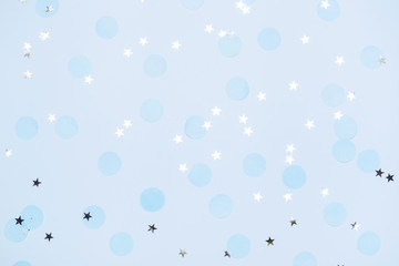 Blue festive confetti, glitter and stars. New year and christmas background. Copy space for text....