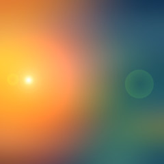 Abstract cyan and green blurred background with orange spot light.