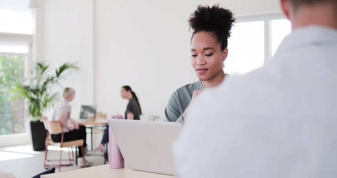 African American Woman working in a coworking space
