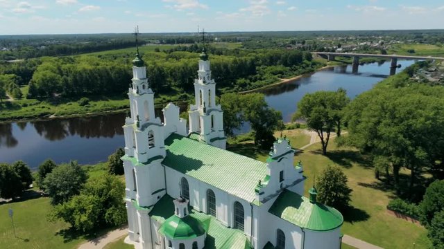 Belarus, Polotsk Aerial View: East Slavic Landmark - Cathedral of Saint Sophia by Dvina River on Sunny Summer Day. 4K Drone Panning Shot